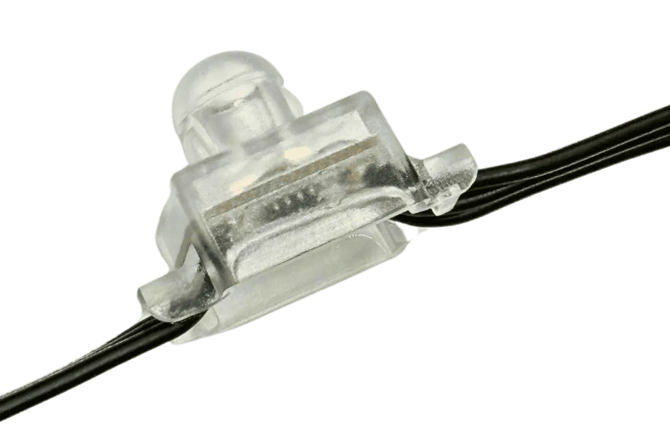 Close-up of a transparent plastic wire connector joining two black electrical wires, shown against a white background.